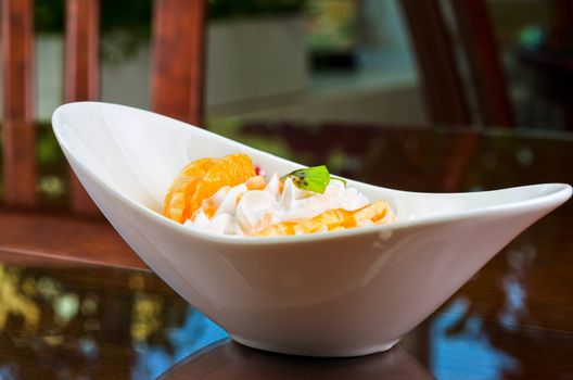 Ice cream dessert with kiwi, strawberry and orange