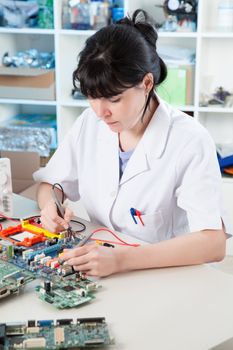 Girl debugging an electronic precision device