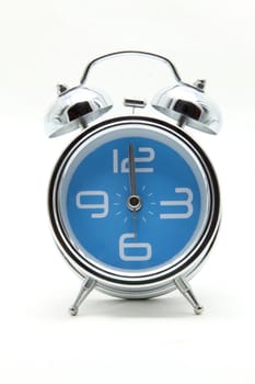 isolated light blue alarm clock on white