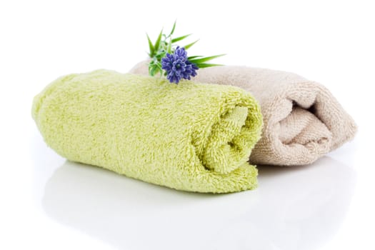 two rolled towel with lavender flower, isolated on white