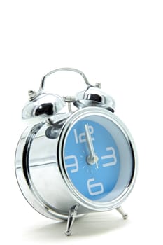 isolated blue alarm clock on white side perspective