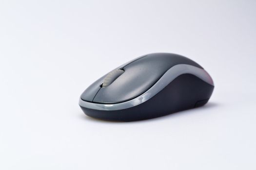 Grey wireless mouse on white surface