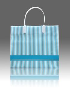 Studio shot of blue strip shopping bag with blank copy space on bag for your text