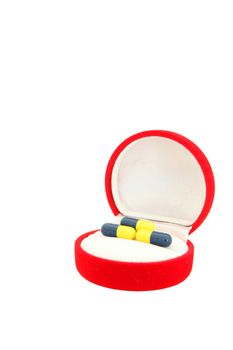 perspective of capsules in red velvet gift box