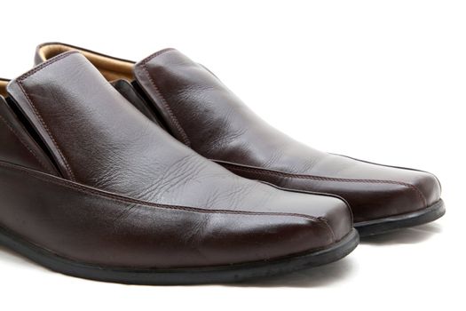 isolated pair of luxury brown leather man shoes on a white background, close up