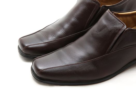 pair of luxury brown leather man shoes on a white background, closeup