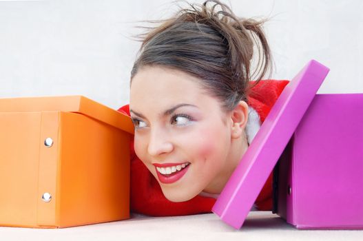 Close-up portrait of happy girl with gift boxes