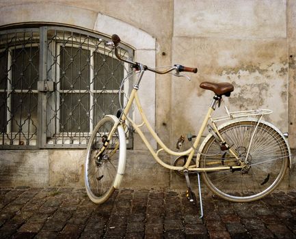 old style rusty bicycle and wall