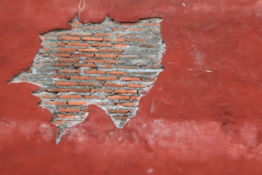 Cracking grunge weathered vintage and fragment of Red brick wall using as background