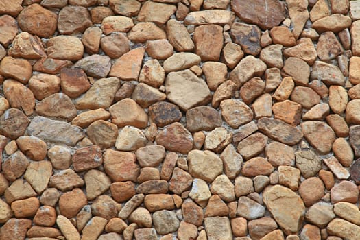 Traditional Stone Brick Wall made of fragment stones in irregular shapes