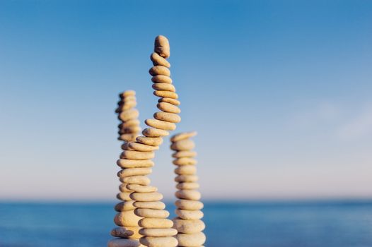 Two pile of pebbles in the balance on the seacoast