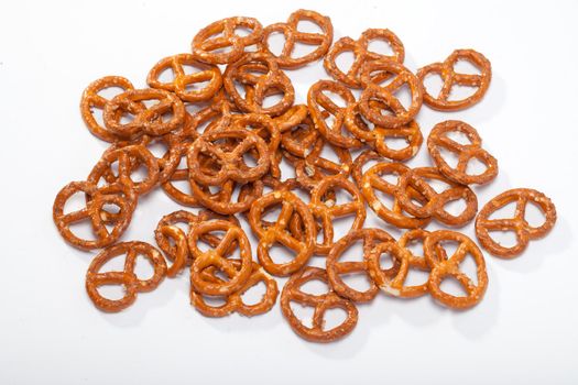 salted pretzels on white background 