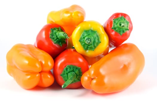 A pile of peppers shot on a white background.