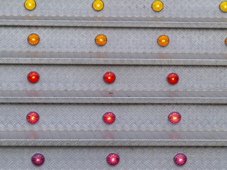 stairs made of aluminium, illuminated with yellow, orange, red and purple lights