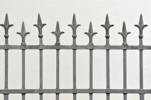 Wrought iron fence with decotative arrows