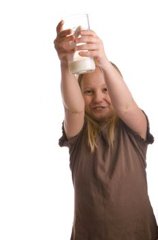 Milk champion girl lifting her glass after a drink and a mustache