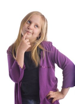 A girl thinking and tapping her chin and looking up.