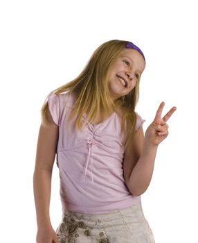 Girl giving peace sign while smiling