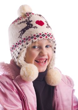 Child in a pink coat and reindeer hat on a white background