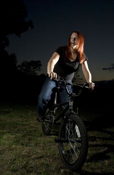 Girl riding a bmx bike.

Shot lit with two flashes, outside.
