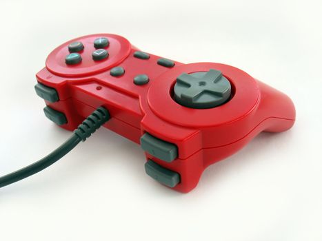 A bright red video game controller - isolated over white.