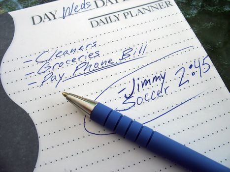 a very busy schedule - written out on a daily planner