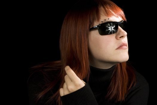 Girl playing with her hair. With sunglasses.

Lit with three studio strobes.