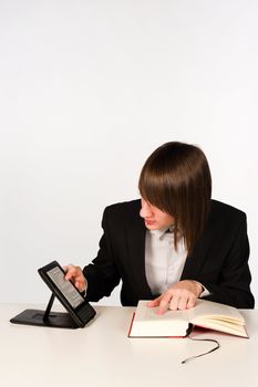 Student with a conventional and an electronic book