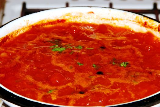 Borsch is in a pan. Red seething  Russian soup.