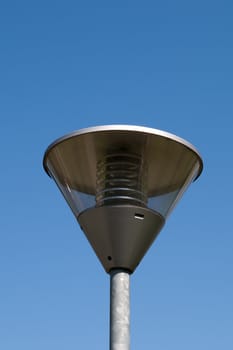 the street lantern with economic lamp on blue sky
