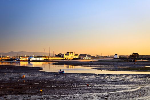 Sunset on the Tejo river with Barreiro mills in background.