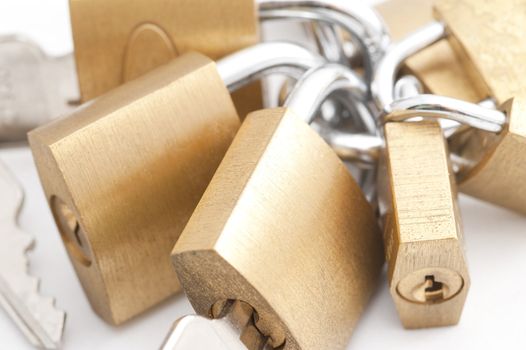 A high key image of some brass padlocks