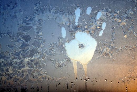 Handprint on ice window, sign desires spring