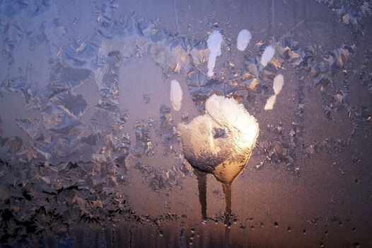 Handprint on ice window, sign desires spring