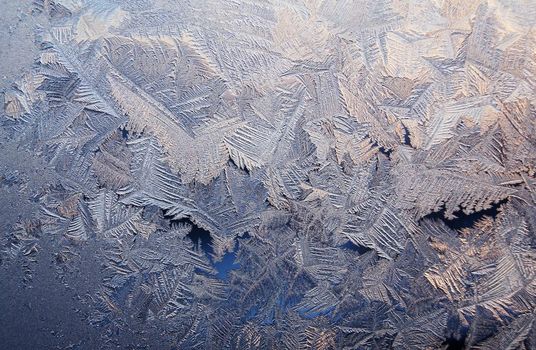 Ice pattern on window, winter sunset
