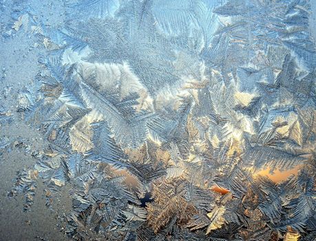 Ice pattern on window, winter sunset