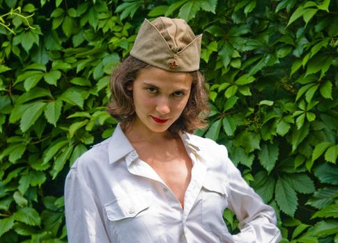 Beautiful girl wearing a soviet soldier cap