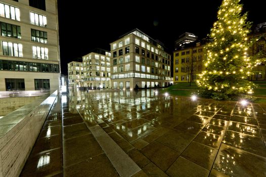 Reflection of buildings on a wet concrete floor in Frankfurt Germany