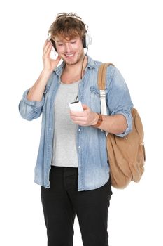 University student listening to music in headphones on smartphone. Young handsome male college student isolated on white background.