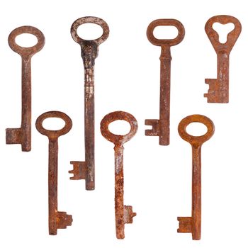 Set of old rusty keys, isolated on white