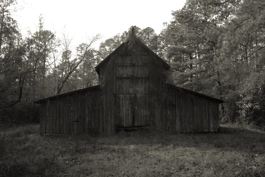 An old abandonded barn shown in black and white