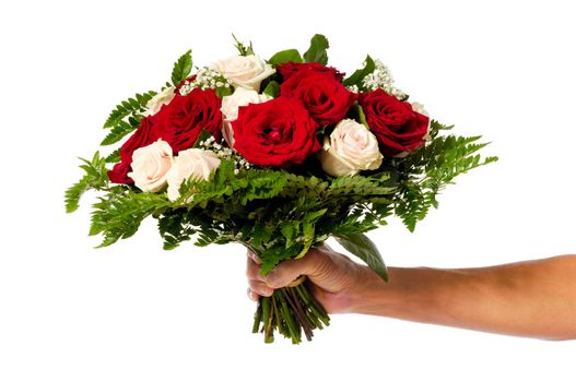 A womans hand is holding a bouquet of flowers isolated on white background