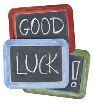 good luck wishes - white chalk handwriting on small slate blackboards with colorful wood frames