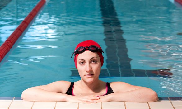 young woman relaxed on swimming pool.