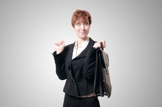 happy business woman with briefcase on gray background