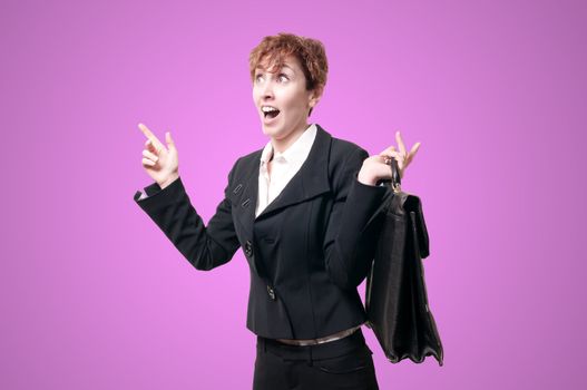 astonished business woman with briefcase on pink background