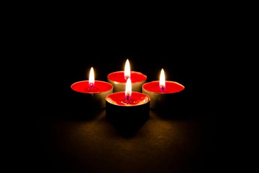 Red candles on a dark background