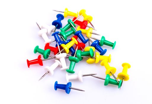 Colorful plastic pushpin on white background