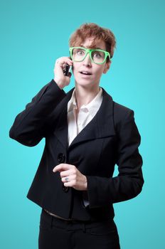 business woman calling on phone on blue background