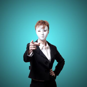 business pointing girl with white mask on gray background